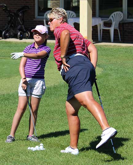 Participant with Golf Instructor