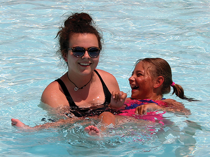 Camp Counselor with Child in Pool