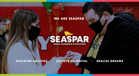 A photo of a SEASPAR participant and staff holding hands. We Are SEASPAR. SEASPAR: Special Recreation Association.