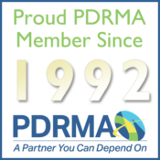 a badge indicating SEASPAR's membership with PDRMA since 1992.