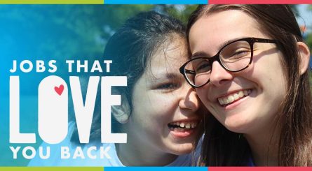 A close up image of a young lady and a young woman wearing glasses, embracing and smiling. Title reads Jobs that Love you back.